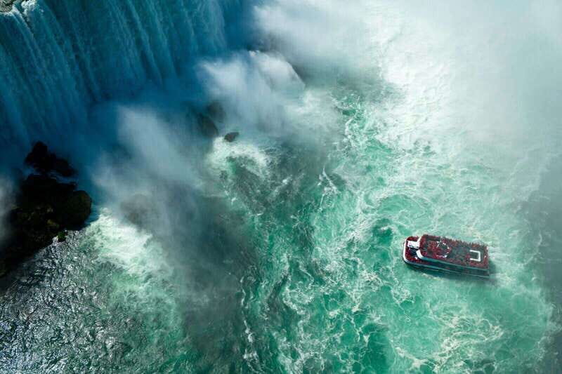 Toronto: Niagara Falls Tour with Cruise and Behind The Falls - Niagara Parkway photo stops: Floral Clock and the Whirlpool Rapids