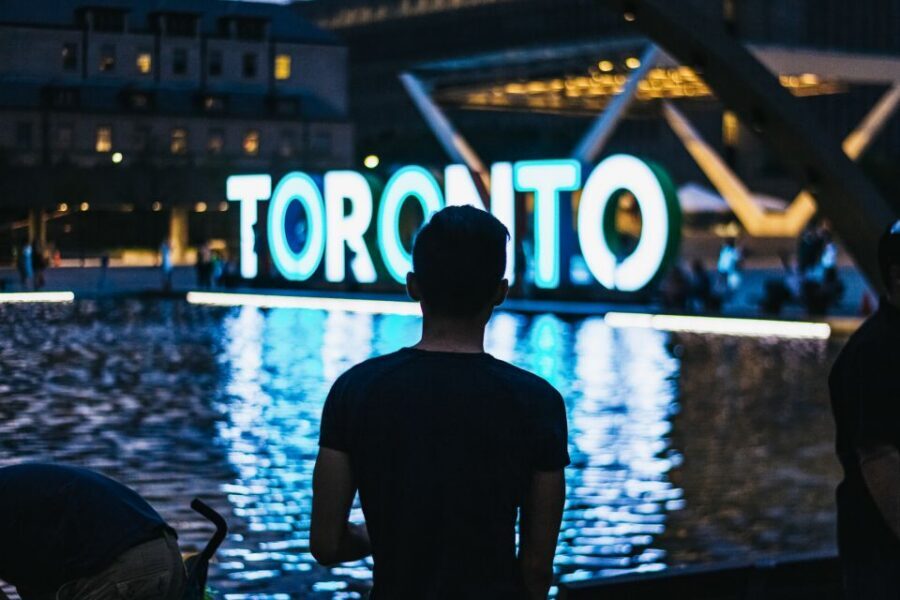 Toronto: Premium Night Driving Tour with Tower Entry - Distillery District at night: cobblestones, shops, and a slower pace