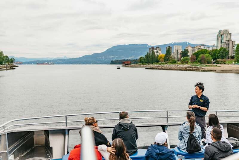 Vancouver: Covered Whale Watching Adventure with Free Photos - Luxury catamaran comfort: heated inside, sharp views outside